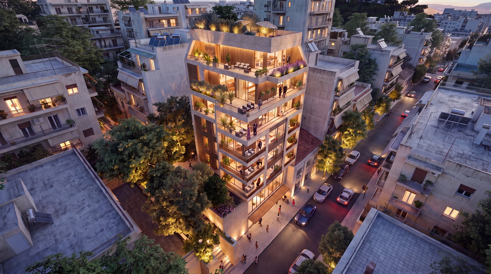 The building at dusk from above, its terraces planted and lit within the Athens block